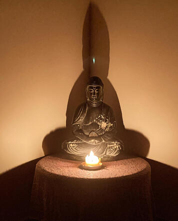 Buddha with candle Buddha with candle